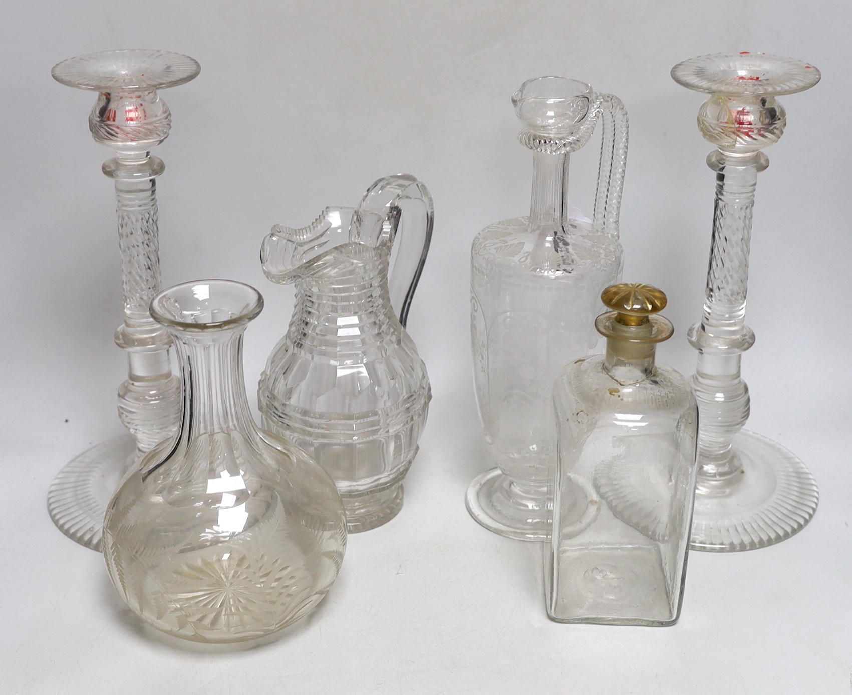 A group of 19th century and later glassware including an Edwardian decanter with floral etched decoration and a pair of glass candlesticks, the largest 29cm high